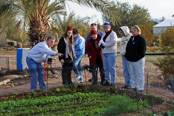 Jutta Engelhardt and Caroline Wise touring Tonopah Rob’s Vegetable Farm in Arizona