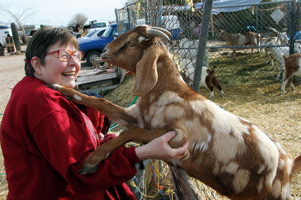 Jutta Engelhardt and a goat from Chile Acres in Tonopah, Arizona