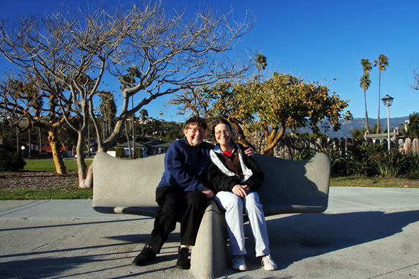 Jutta Engelhardt and Caroline Wise sitting on the whale tail bench at Shoreline Park in Santa Barbara, California