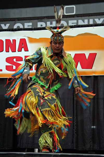 Lane B. Jensen, Navajo Hoop Dancer performing a Grass Dance at the Arizona Travel Show in Glendale, Arizona