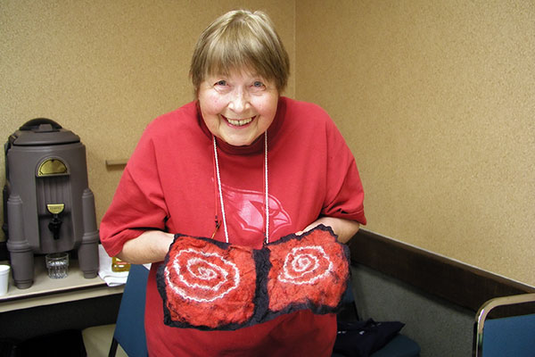 Jutta Engelhardt with her felted book cover made at Fibers Through Time in Tucson, Arizona