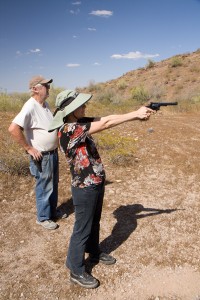 Jimmie Petersen and Caroline with handgun